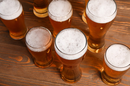 Glasses of cold beer on wooden background. celebrationの写真素材