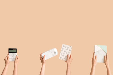 Hands with school supplies on beige backgroundの写真素材