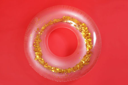 Inflatable ring on red background
