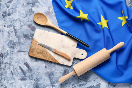 Flag of European Union with kitchen utensils on gray grunge backgroundの写真素材