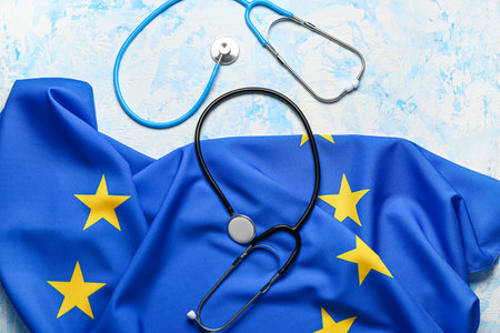 Flag of European Union with stethoscopes on light blue backgroundの写真素材