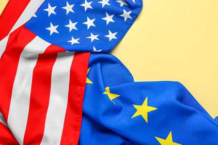 Flags of European Union and USA on yellow backgroundの写真素材