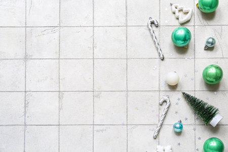 Different Christmas decorations on white tile backgroundの写真素材