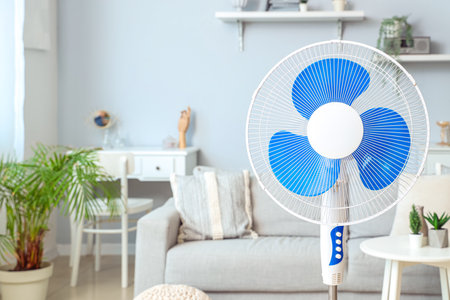 Floor fan in interior of light living roomの写真素材