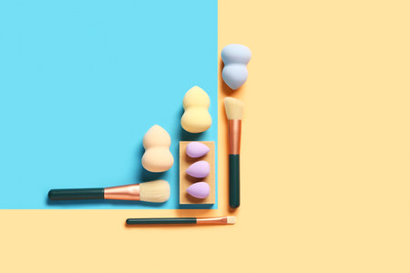 Makeup sponges and brushes on colorful backgroundの写真素材
