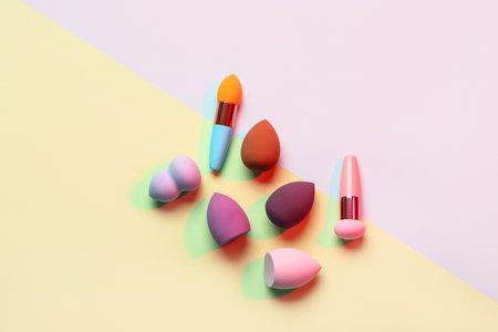 Different makeup sponges on colorful backgroundの写真素材