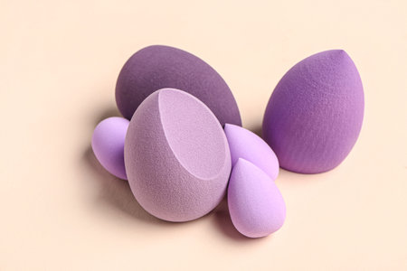 Different makeup sponges on beige backgroundの写真素材