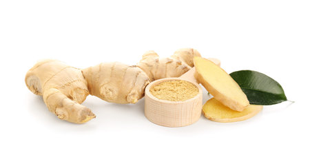 Fresh ginger root and wooden spoon with dried powder on white background