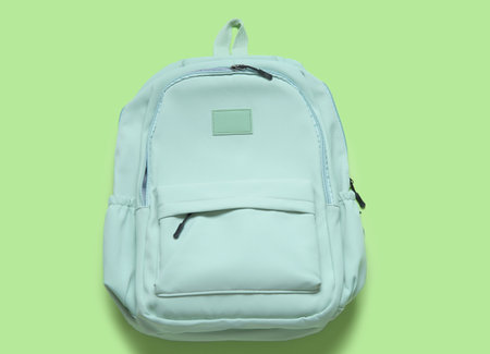 school backpack on green backgroundの写真素材