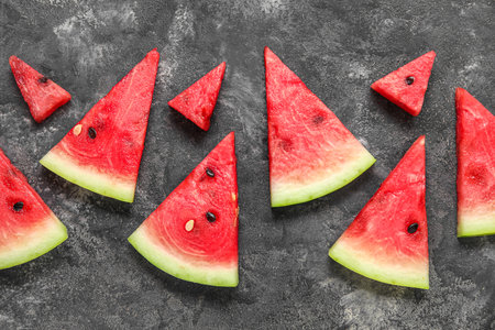 Composition with pieces of fresh ripe watermelon on dark backgroundの写真素材