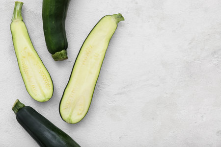 Fresh green zucchini on white backgroundの写真素材