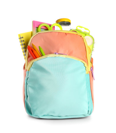 Colorful school backpack with bottle of water and different stationery on white backgroundの写真素材
