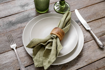 Stylish modern table setting on brown wooden backgroundの写真素材
