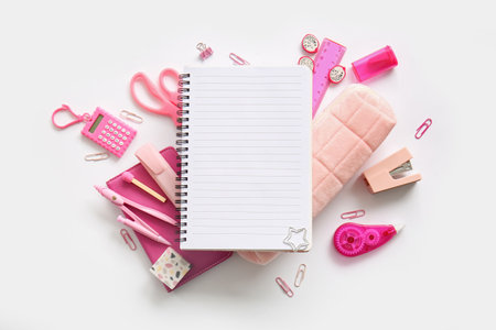Composition with blank notebook and different school stationery on white backgroundの写真素材