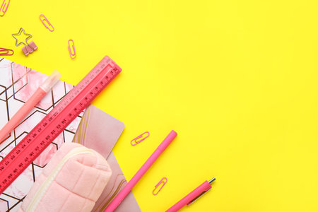 Composition with colorful stationery on yellow backgroundの写真素材