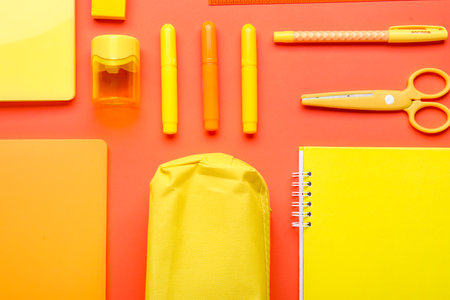 Composition with colorful stationery on red backgroundの写真素材