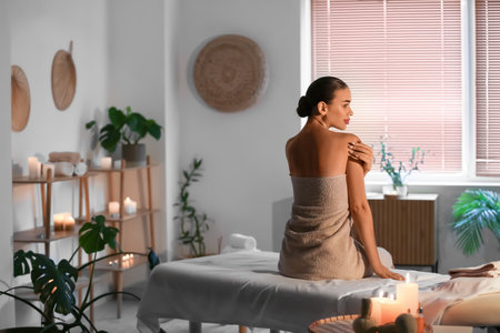 Pretty young woman in spa salonの写真素材