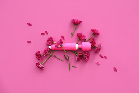 Beautiful chrysanthemum flowers and vibrator on pink backgroundの写真素材