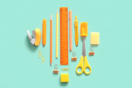 Different school stationery on turquoise backgroundの写真素材