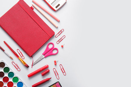 Different school stationery and notebook on gray backgroundの写真素材