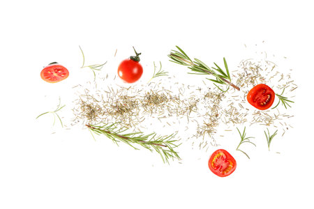 Flying spices, rosemary and tomatoes on white backgroundの写真素材
