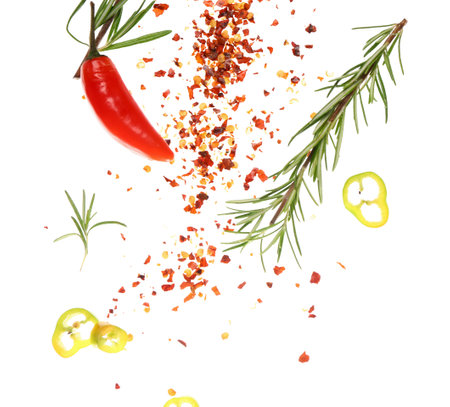 Flying spices and rosemary on white backgroundの写真素材