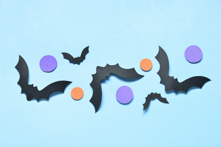 Paper bats for Halloween party on blue backgroundの写真素材