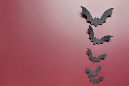 Paper bats for Halloween party on brown backgroundの写真素材