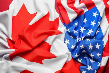 Flags of Canada and USA on red backgroundの写真素材