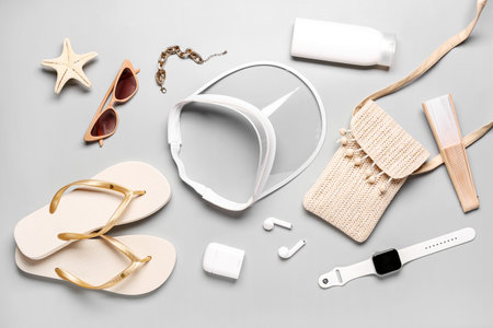 Composition with beach accessories and modern gadgets on gray backgroundの写真素材