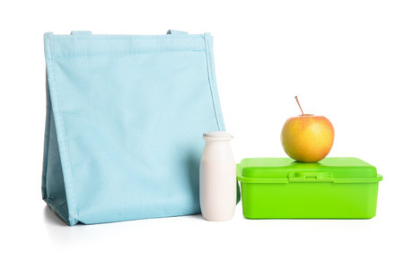 Lunch bag and lunchbox with delicious food isolated on white backgroundの写真素材