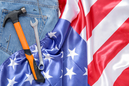 Different tools on USA flag and jeans. labor day celebrationの写真素材