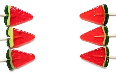 Lollipops in shape of watermelon slice on white backgroundの写真素材
