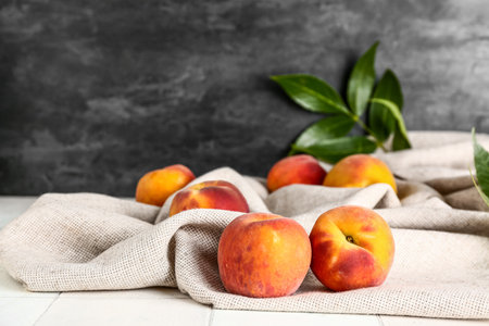 Sweet peaches on white tile tableの写真素材