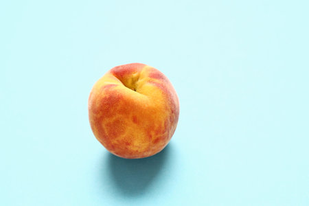 Sweet peach on blue background