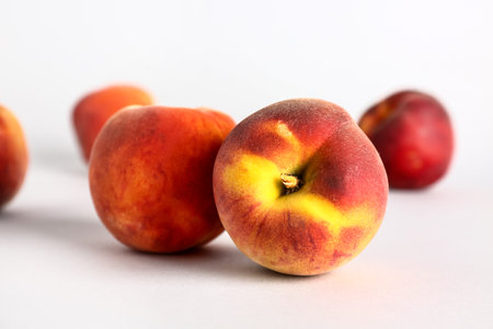 Sweet peaches on white backgroundの写真素材