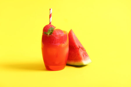 Glass of tasty watermelon fresh on yellow backgroundの写真素材