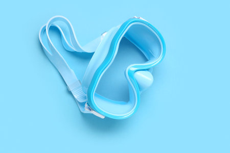 New swimming mask on blue background