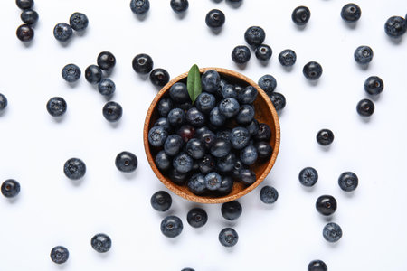 Bowl with fresh blueberries on gray backgroundの写真素材