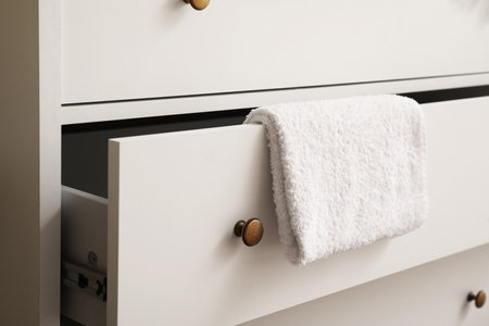 White chest of drawers with towel, closeupの写真素材