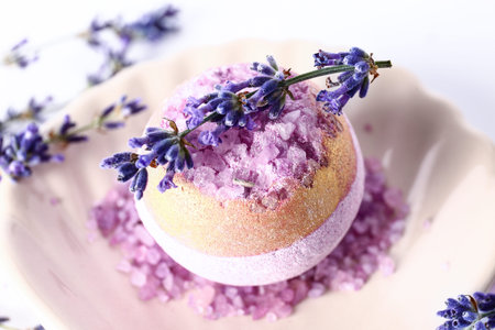 Composition with bath bomb and aromatic lavender flowers on light background, closeupの写真素材