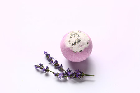 Bath bomb and lavender flowers isolated on white backgroundの写真素材