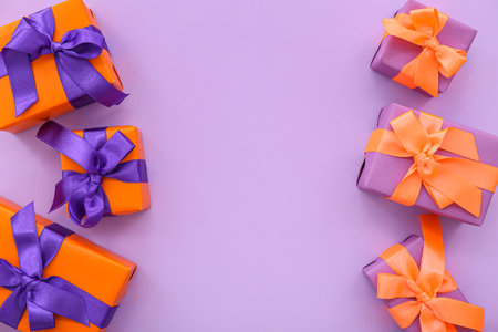 Beautiful gift boxes for Halloween on purple backgroundの写真素材