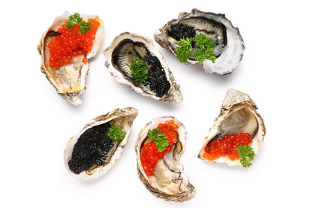 Tasty oysters with black and red caviar on white backgroundの写真素材