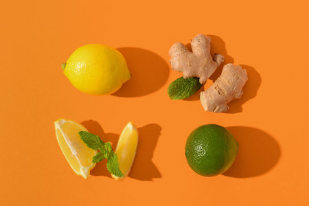 Ingredients for preparing lemonade on orange backgroundの写真素材