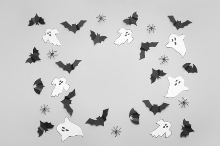 Composition with paper bats and ghosts on white background. halloween celebration conceptの写真素材