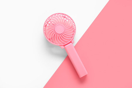 Modern manual fan on color backgroundの写真素材