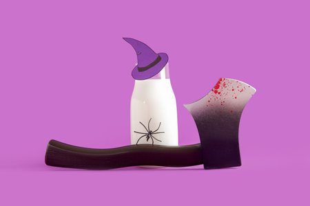Bottle of milk, hat made of paper, ax and spider for Halloween on purple backgroundの写真素材