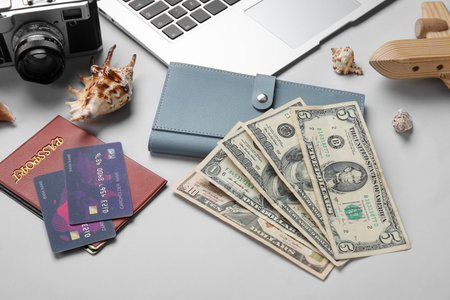 Wallet, money, credit cards and seashells on white backgroundの写真素材