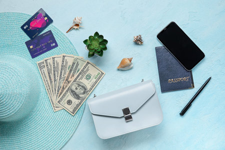 Composition with money, credit cards, mobile phone and female accessories on color background